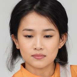 Neutral asian young-adult female with medium  brown hair and brown eyes