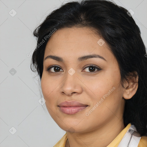 Joyful latino young-adult female with medium  brown hair and brown eyes