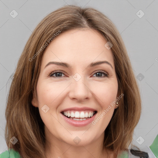 Joyful white young-adult female with medium  brown hair and green eyes