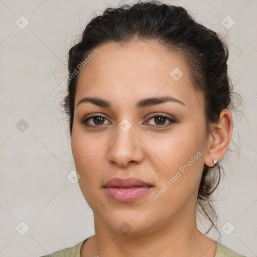 Joyful latino young-adult female with short  brown hair and brown eyes