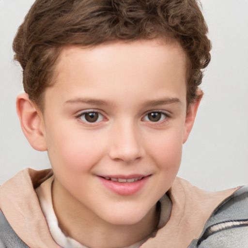 Joyful white child male with short  brown hair and brown eyes