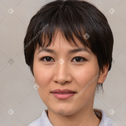 Joyful asian young-adult female with medium  brown hair and brown eyes