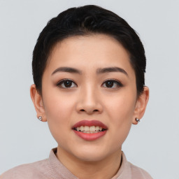 Joyful asian young-adult female with short  black hair and brown eyes