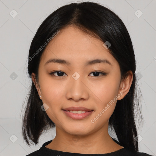 Joyful asian young-adult female with medium  black hair and brown eyes