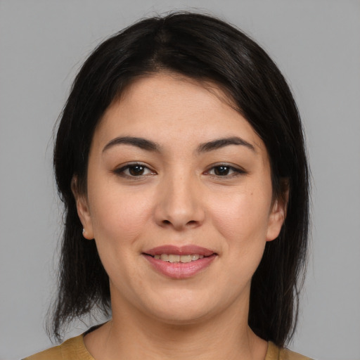 Joyful latino young-adult female with medium  black hair and brown eyes