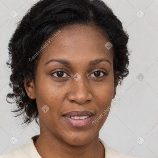 Joyful black adult female with medium  brown hair and brown eyes