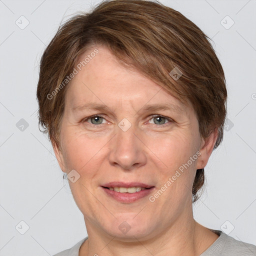 Joyful white adult female with short  brown hair and grey eyes