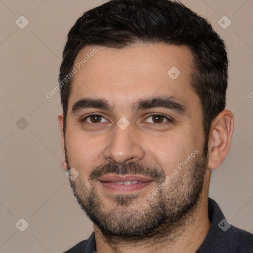 Joyful white young-adult male with short  black hair and brown eyes