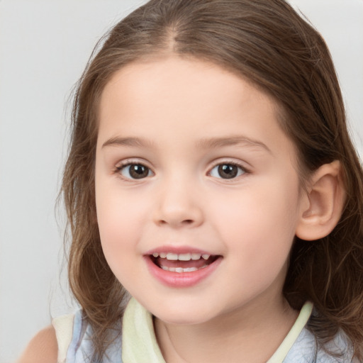 Joyful white child female with medium  brown hair and brown eyes