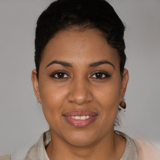 Joyful black young-adult female with short  brown hair and brown eyes