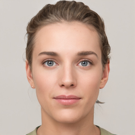 Neutral white young-adult female with short  brown hair and grey eyes