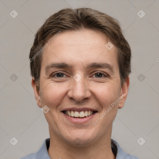 Joyful white adult male with short  brown hair and grey eyes