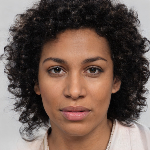 Neutral latino young-adult female with medium  brown hair and brown eyes