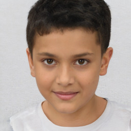 Joyful white child male with short  brown hair and brown eyes