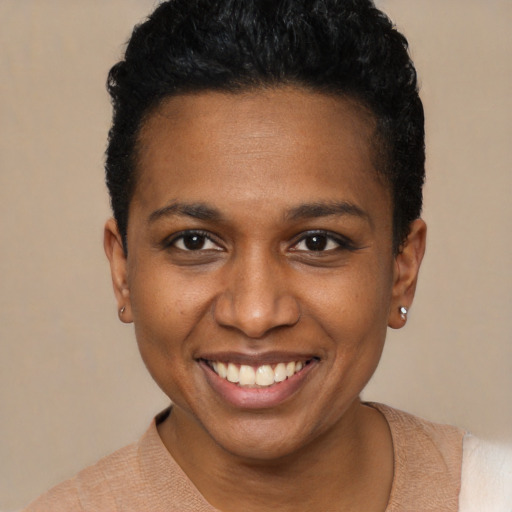 Joyful black young-adult female with short  brown hair and brown eyes