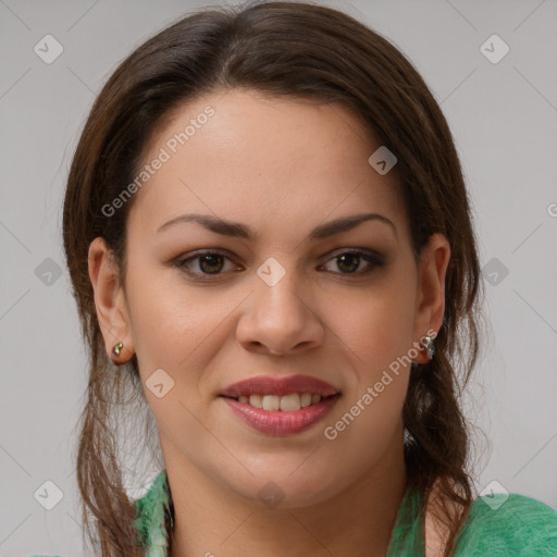 Joyful white young-adult female with medium  brown hair and green eyes