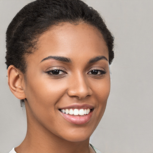 Joyful latino young-adult female with short  brown hair and brown eyes