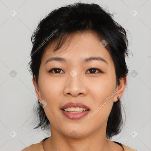 Joyful asian young-adult female with medium  black hair and brown eyes