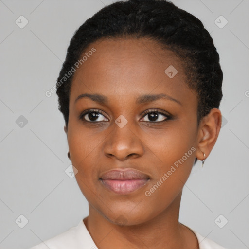 Joyful black young-adult female with short  black hair and brown eyes