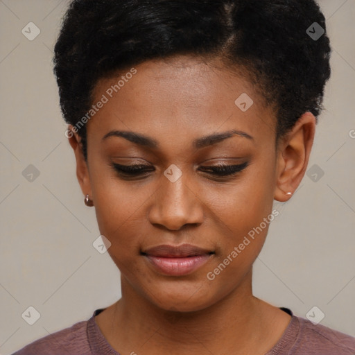 Joyful black young-adult female with short  black hair and brown eyes