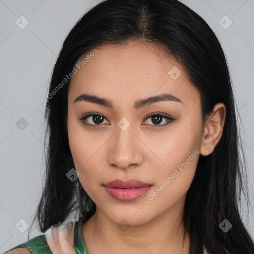 Joyful latino young-adult female with long  brown hair and brown eyes