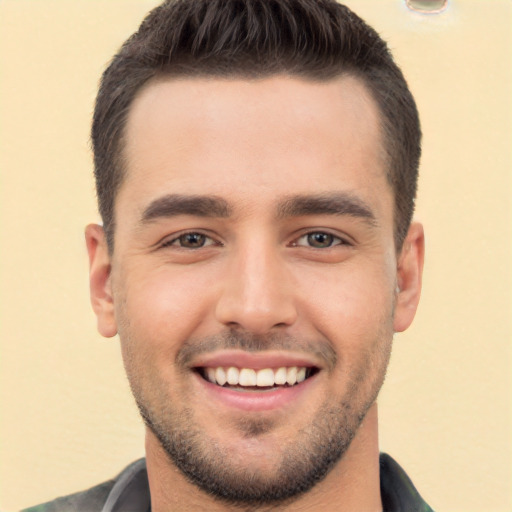 Joyful white young-adult male with short  brown hair and brown eyes