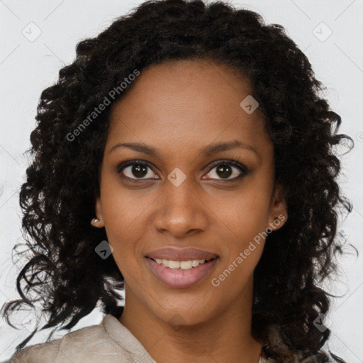 Joyful black young-adult female with long  brown hair and brown eyes