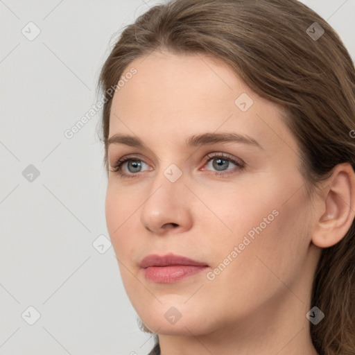 Neutral white young-adult female with long  brown hair and grey eyes