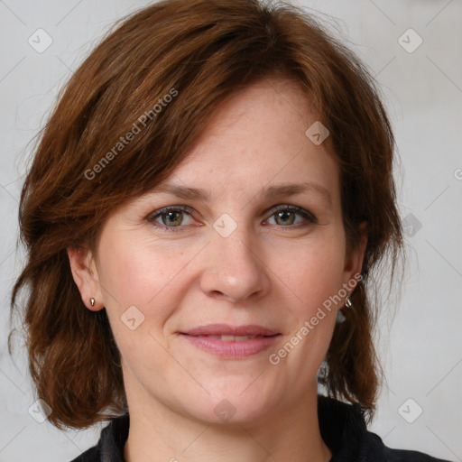 Joyful white adult female with medium  brown hair and grey eyes