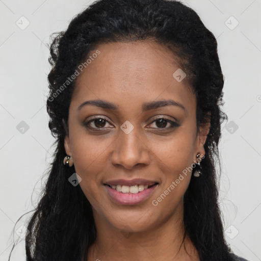 Joyful black young-adult female with long  black hair and brown eyes