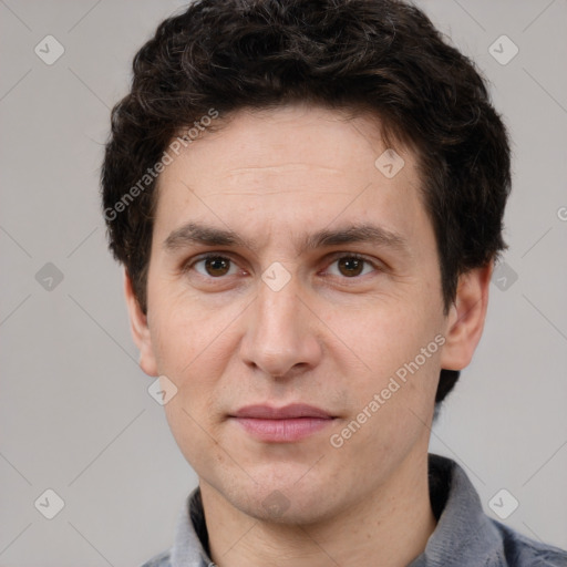 Joyful white adult male with short  brown hair and brown eyes