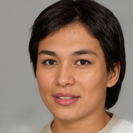 Joyful white young-adult female with medium  brown hair and brown eyes