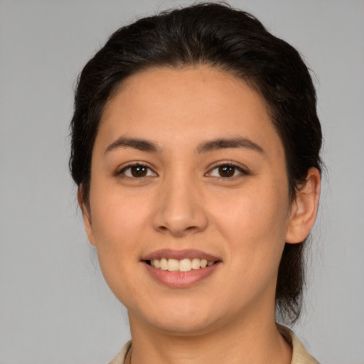 Joyful white young-adult female with medium  brown hair and brown eyes