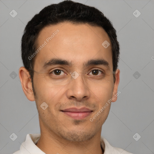 Joyful white young-adult male with short  black hair and brown eyes