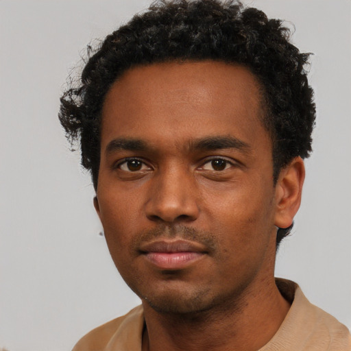 Neutral black young-adult male with short  black hair and brown eyes