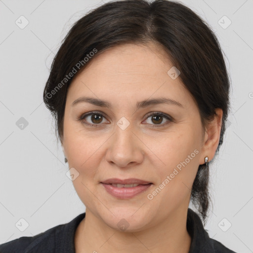 Joyful white adult female with medium  brown hair and brown eyes