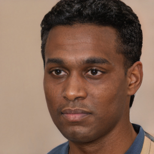 Neutral black young-adult male with short  black hair and brown eyes