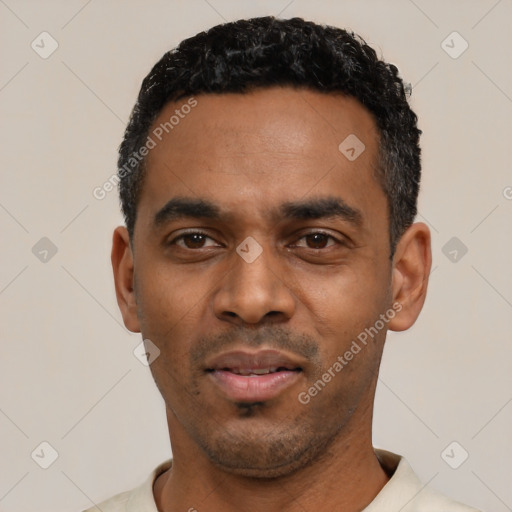 Neutral black young-adult male with short  black hair and brown eyes