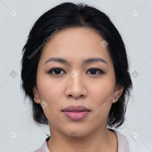 Joyful asian young-adult female with medium  black hair and brown eyes