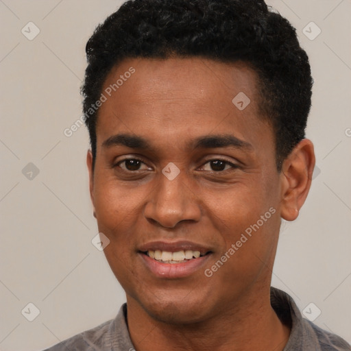 Joyful black young-adult male with short  black hair and brown eyes