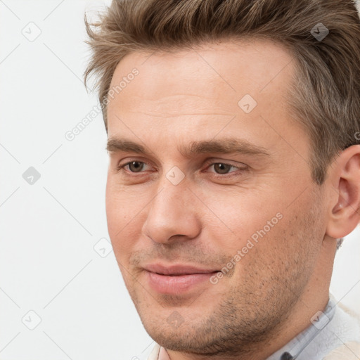 Joyful white adult male with short  brown hair and brown eyes