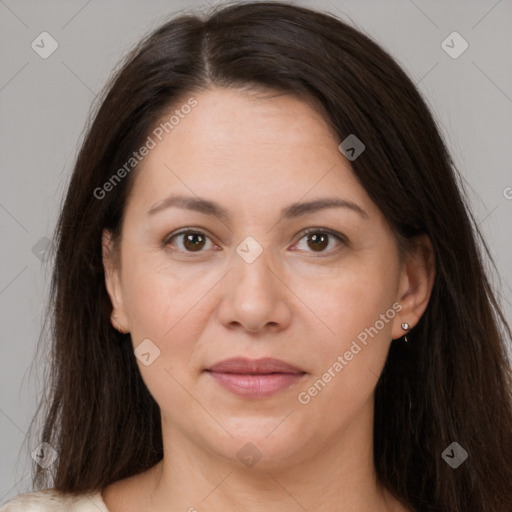 Joyful white adult female with long  brown hair and brown eyes