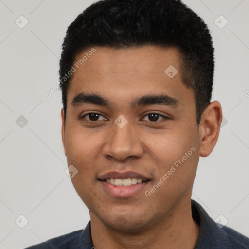 Joyful white young-adult male with short  black hair and brown eyes