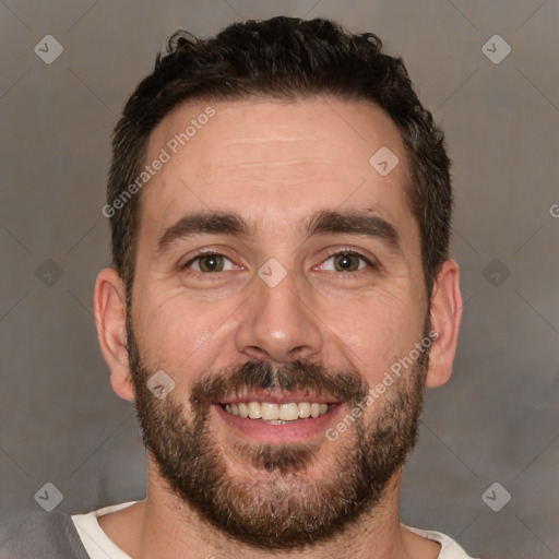 Joyful white adult male with short  brown hair and brown eyes