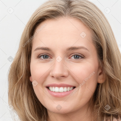 Joyful white young-adult female with long  brown hair and blue eyes