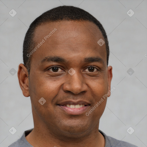 Joyful latino young-adult male with short  brown hair and brown eyes
