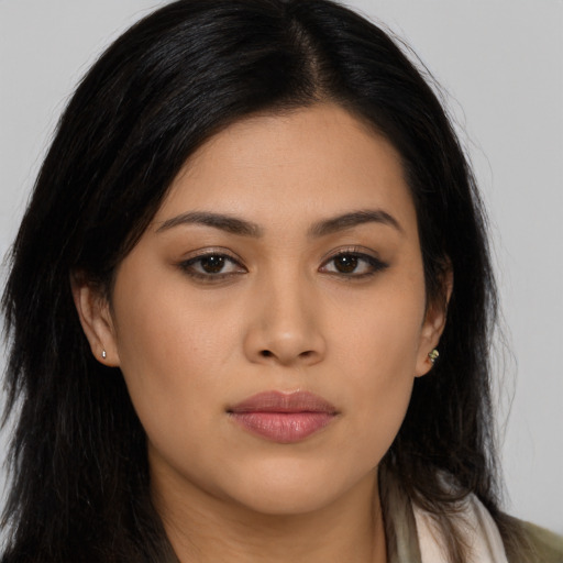 Joyful asian young-adult female with long  brown hair and brown eyes