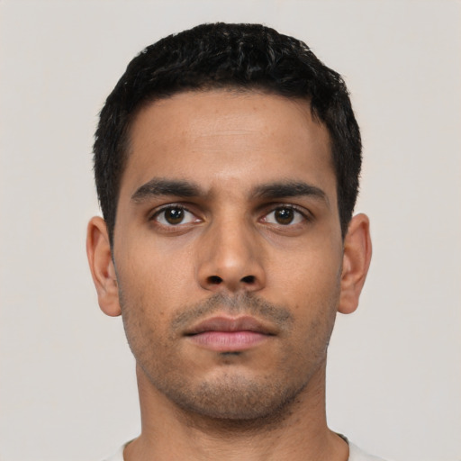 Neutral latino young-adult male with short  black hair and brown eyes