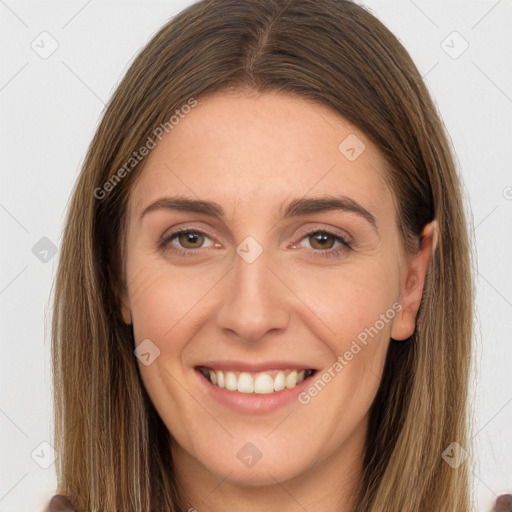 Joyful white young-adult female with long  brown hair and brown eyes