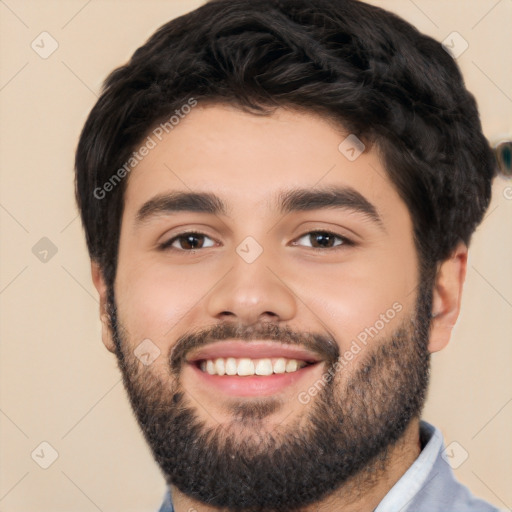 Joyful white young-adult male with short  black hair and brown eyes